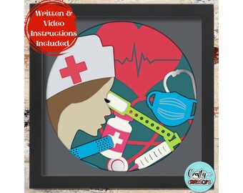 May include: A papercraft design featuring a nurse with a stethoscope, a heart with a heartbeat line, a face mask, a bandage, a bottle of pills, and a syringe. The design is in a circular frame with a gray background. The text "Written & Video Instructions Included" is in a red circle in the top left corner.