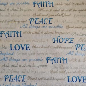 May include: A patterned fabric with inspirational words in blue and gray. The words "Love", "Peace", "Faith", and "Hope" are prominently displayed. Other phrases are also visible, creating a textured, motivational design.