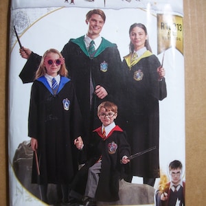 May include: A Harry Potter home sewing pattern featuring a family dressed in Hogwarts robes. The pattern includes images of the characters and the Hogwarts crest. The pattern is labeled with the size range XS-XL.