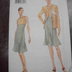May include: A sewing pattern for a dress with a skirt and a cardigan. The pattern is for sizes 18-20-22. The pattern is from Vogue and is labeled "Very Easy".