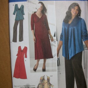 May include: A sewing pattern for a dress and a cardigan. The pattern is from Simplicity and is part of the Khaliah Ali Collection. The pattern is for sizes 10-18.
