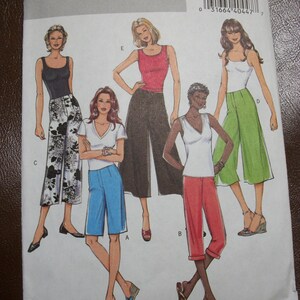 May include: A sewing pattern for women's pants. The pattern includes four different styles of pants, all with a cropped length. The pattern is from Butterick and is size 6-8-10-12.
