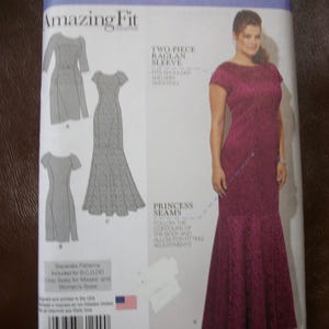 May include: Simplicity sewing pattern 1249 BB, featuring an Amazing Fit collection. The pattern includes designs for dresses with princess seams and two-piece raglan sleeves. The image shows a woman wearing a burgundy dress.