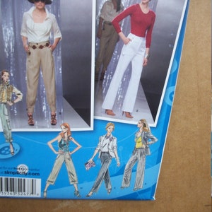 Simplicity 2477 Miss Size D5 4-6-8-10-12 and P5 12-14-16-18-20 Pants with leg width, pocket & length variations.  Project Runway.  FF, uncut