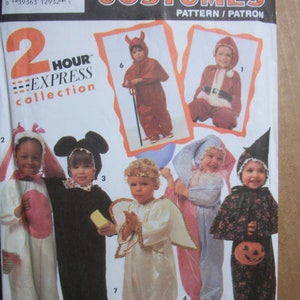 May include: Simplicity Costumes pattern featuring children's Halloween costumes. The pattern includes instructions for making various costumes, including a devil, Santa, bunny, mouse, angel, and witch. The package is labeled "2 Hour Express Collection."