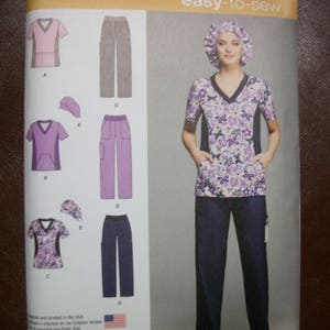 May include: Simplicity sewing pattern 1020 BB, easy-to-sew, for sizes US 20W-28W, Euro 46-54, and French 48-56. The pattern includes instructions for making scrubs with a V-neck top and pants. The pattern also includes instructions for making a scrub cap.