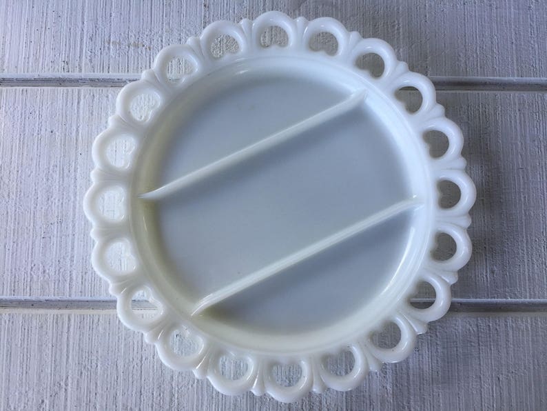 May include: White milk glass divided serving dish with a scalloped edge.