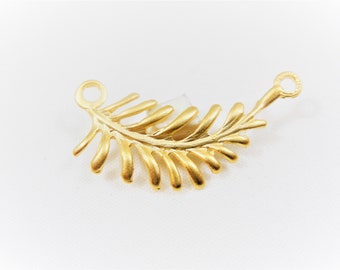 May include: Gold-toned metal fern leaf charm with a loop at each end for attaching to jewelry or other crafts.