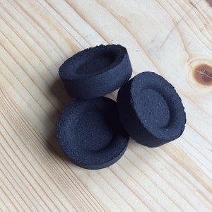 May include: Three round black charcoal briquettes for shisha or hookah smoking.