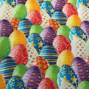 May include: A colorful fabric with a repeating pattern of Easter eggs. The eggs are decorated with various designs, including polka dots, stripes, swirls, and flowers. The eggs are in shades of red, blue, green, yellow, purple, and white.