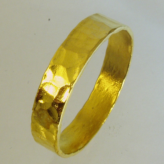 A 24 Karat Yellow Gold Ring.