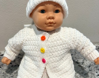 Knitted sweater with hat for a baby .