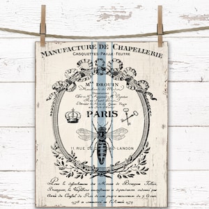 Może przedstawiać: Wizerunek w stylu vintage z czarno-białą ilustracją pszczoły i korony w ozdobnej ramie. Tekst brzmi "Manufacture de Chapelierie Casquettes Paille Feutre M Drouin Demeurant Chez Furgaull Rue Saint Bonor Paris 11, Rue de l'Eau-Landon".