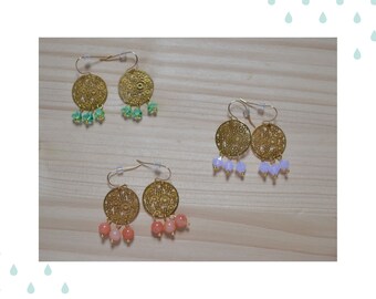 Golden earrings and pastel pearls