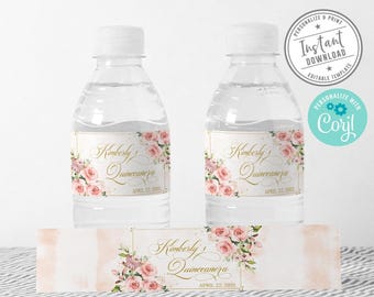 May include: Two clear plastic water bottles with custom labels featuring pink roses, gold text reading Kimberly's Quinceanera, and the date April 22, 2021. A matching rectangular label is displayed in front of the bottles on a surface.