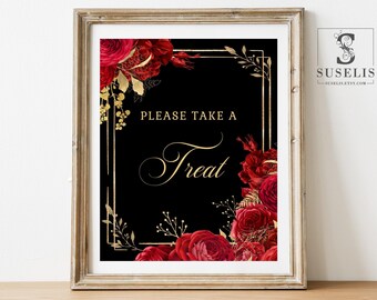 May include: A rectangular sign in a light wood frame featuring a black background with the gold text "PLEASE TAKE A Treat". The design is decorated with deep red roses and gold foliage accents arranged in the top left and bottom right corners.