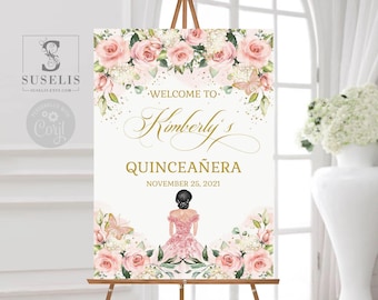 May include: A rectangular welcome sign for a Quinceañera featuring pink roses, white flowers, and butterflies. The text reads: Welcome to Kimberly's Quinceañera November 25, 2021. An illustration of a person in a pink dress is centered at the bottom.