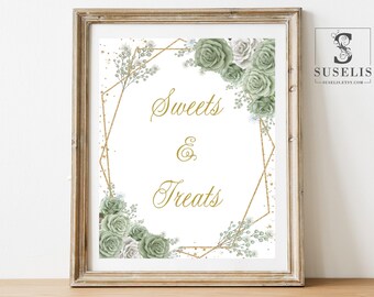 May include: A framed sign with the text Sweets & Treats in gold script. The design features a gold geometric frame accented with sage green and white roses, small white flowers, and gold speckles on a white background.