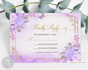 May include: A rectangular RSVP card featuring a watercolor purple floral design with gold foil-style borders and a small butterfly. The text reads Kindly Reply, By November 5, 2022, M, Accepts with delight, Declines with regret, and Number of guests attending.
