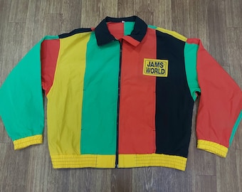 May include: A multi-colored jacket with a zipper closure. The jacket has stripes of red, yellow, green, and black. The jacket has a logo on the front that says "JAMS WORLD".