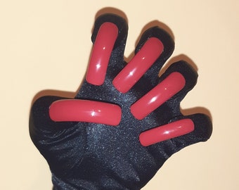 May include: A black long glove with red fingertip covers. The glove is made of a shiny fabric and has a textured surface.