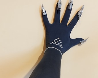 May include: Black long-sleeved glove with silver rhinestones and silver claw-like fingernail accents.