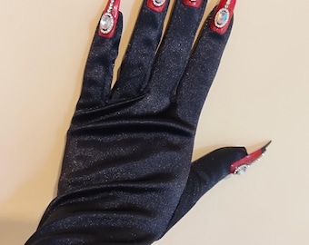 May include: Black satin gloves with long, pointed red fingernails adorned with rhinestones.
