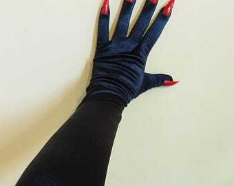May include: A pair of long black satin gloves with red pointed fingernails.