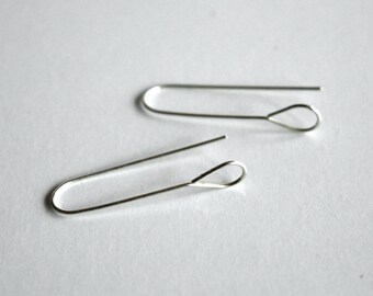 May include: Two silver earring hooks with a teardrop-shaped loop at the end.