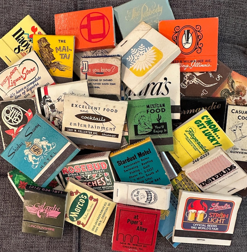 May include: A collection of vintage matchbook covers with various designs and text. The matchbooks feature a variety of themes, including hotels, restaurants, bars, and businesses. Some of the matchbooks have colorful illustrations, while others have simple text designs. The matchbooks are a great example of vintage advertising and ephemera.