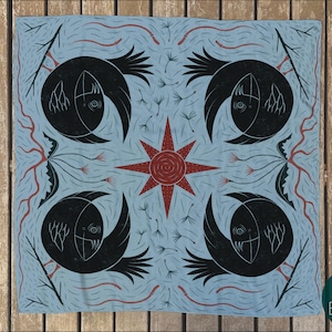 May include: A blue and black patterned square fabric with a repeating design of stylized birds and a red star in the center.