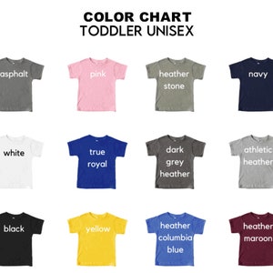 May include: Color chart showing 12 different t-shirt colors for toddlers. The colors are: asphalt, pink, heather stone, navy, white, true royal, dark grey heather, athletic heather, black, yellow, heather columbia blue, and heather maroon.