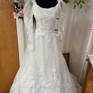 Lyric is a beautiful vintage House of Bianchi wedding gown!