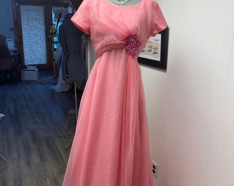Emmie is a pink/fuchsia vintage dress