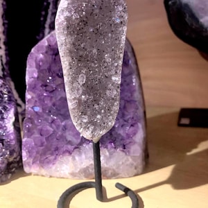 Sugar Amethyst small silver grey Geode on fixed stand.
