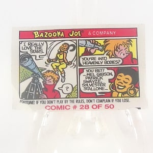 May include: A vintage Bazooka Joe comic strip featuring colorful panels. The top banner reads "BAZOOKA JOE & COMPANY." Comic panels depict characters discussing stars and heavenly bodies. Text includes "COMIC # 28 OF 50" and a fortune.