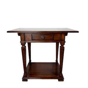 May include: A dark brown wooden side table featuring a rectangular top, a single central drawer with a small round knob, and four fluted legs that support a lower square shelf. The table has a smooth, polished finish and a sturdy construction.