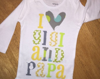 Personalized, appliqued baby onesie in pastels