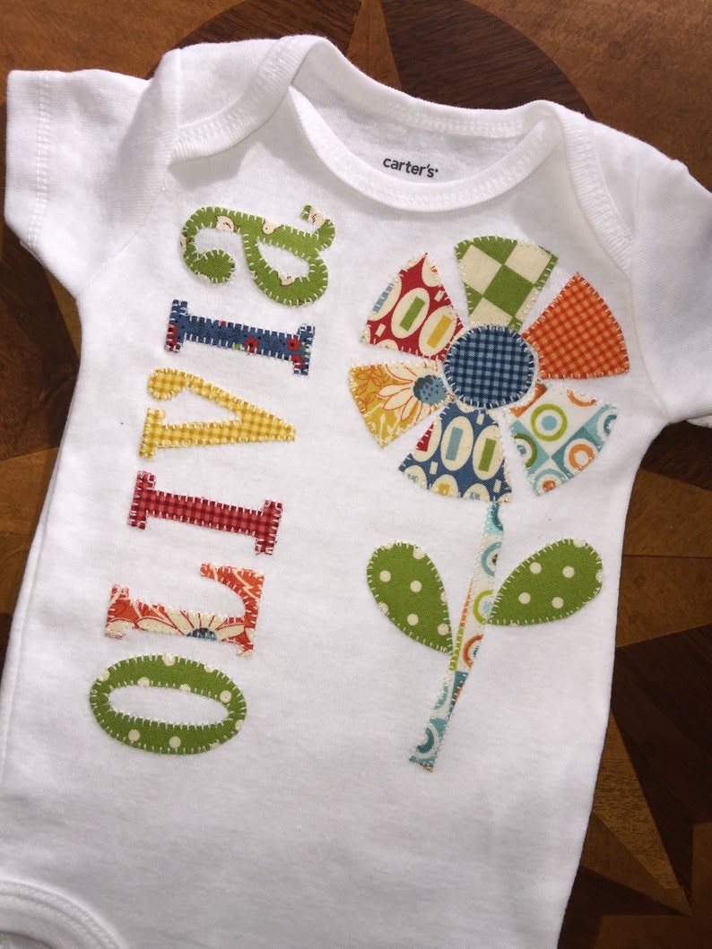Personalized appliqu\u00e9d patchwork flower baby onesie