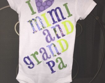 Custom appliqued green and purple onesies