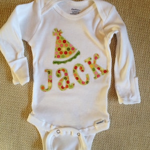 Personalized birthday party with party hat baby onesie