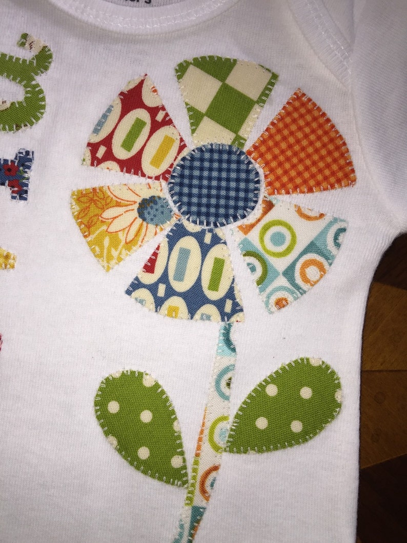 Personalized appliqu\u00e9d patchwork flower baby onesie