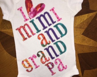 Girly multicolored appliques and personalized onesie
