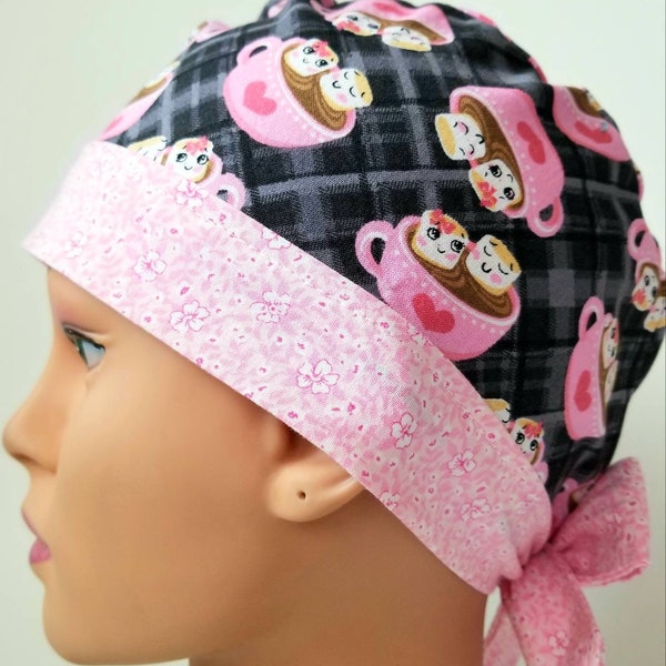 Womens fitted scrub cap. Hot chocolate smores. Coffee cup. Black/grey background with wide floral pink band.