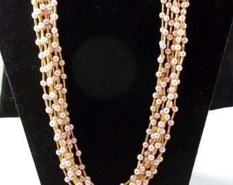 Vintage pink faux pearl 8-strand necklace and earrings with gold tone accents