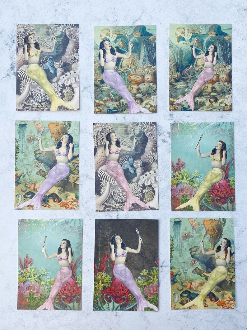 May include: Nine vintage postcards featuring a mermaid with a mirror in an underwater scene. The mermaids are all wearing different colored shells and have long flowing hair. The backgrounds are all different shades of blue and green and feature various sea creatures.