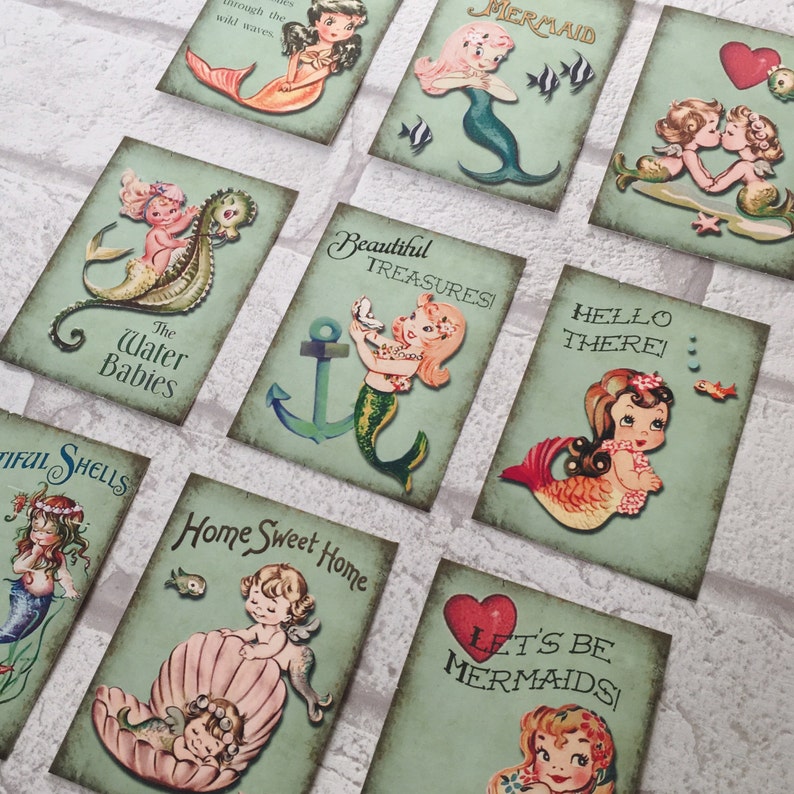 May include: A set of ten printable cards featuring illustrations of mermaids, seahorses, and anchors. The cards have a vintage aesthetic and feature text such as "The Water Babies", "Beautiful Treasures", "Hello There", "Home Sweet Home", and "Let's Be Mermaids".