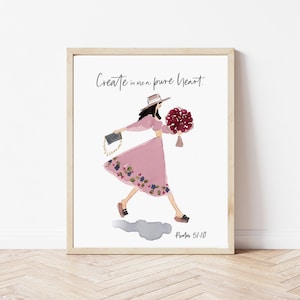 May include: A framed print with a watercolor illustration of a woman in a pink dress and hat, holding a bouquet of red flowers. The text "Create in me a pure heart." and "Psalm 51:10" are printed below the illustration.
