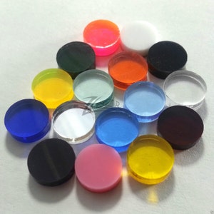 May include: Assortment of 15 round, colorful acrylic discs. The discs are various colors, including red, orange, yellow, green, blue, purple, pink, black, and white. The discs are all the same size and are arranged in a circle.