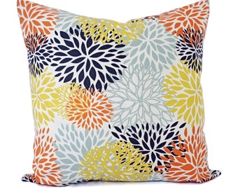 Navy and top orange throw pillows